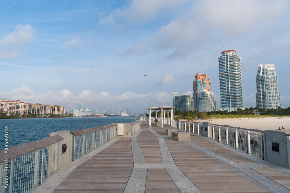 Miami beach boardwalk along Government Cut water channel at South Pointe in Florida, USA