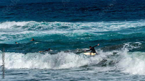 surfing on the beach of la cicer in Las Plamas de Gran Canaria