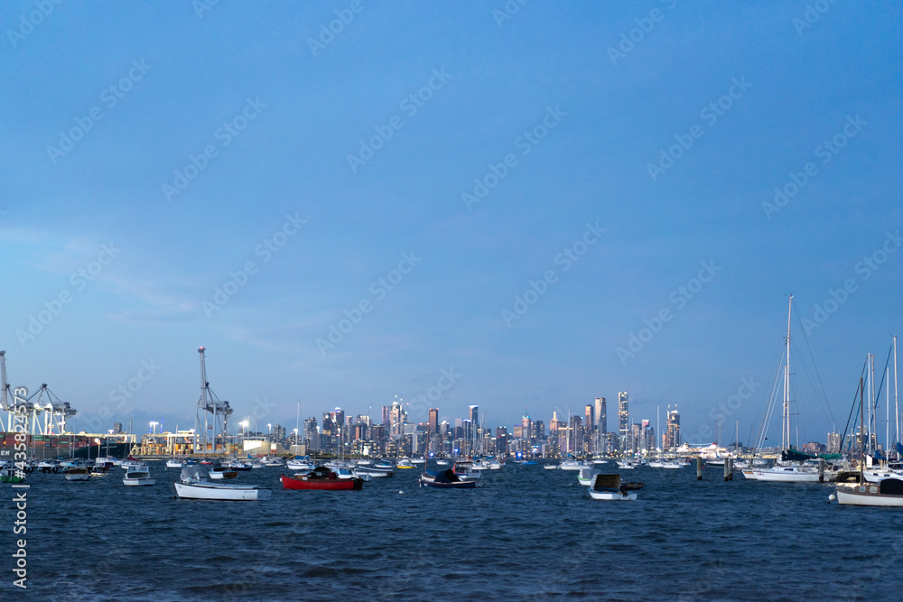 Evening view of Williamstown Melbourne Victoria Ports and Harbours Fisherman Boats with Melbourne city as a background. 