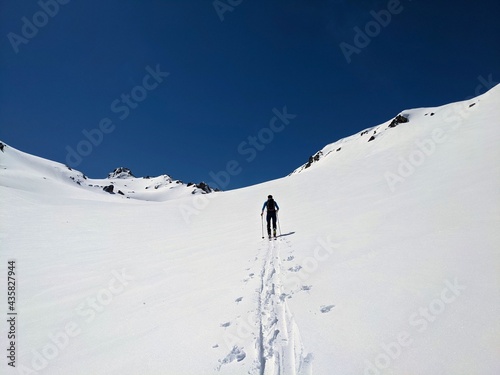  ski mountaineering on the sentisch horn from the fluela pass near davos klosters in the graubunden swiss mountains. ski