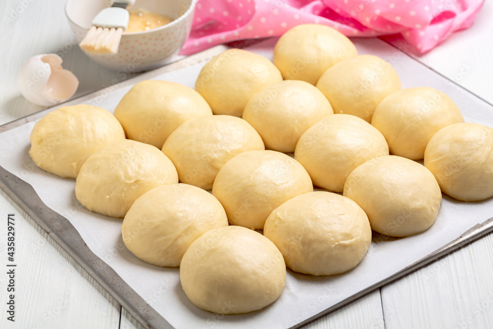 Sweet yeast buns before baking.