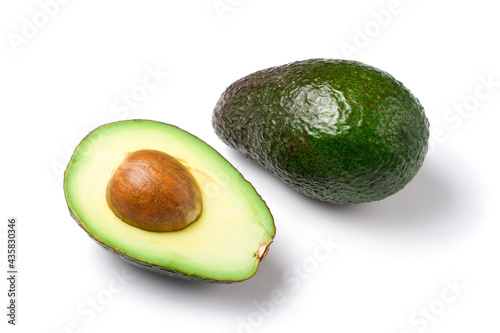 avocados, whole and half, with core, isolated on white background