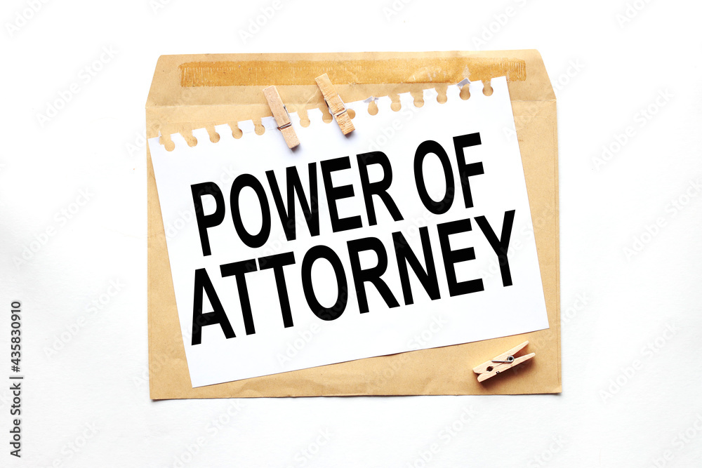 power of attorney. text on white paper on craft notebook power of attorney. text on white paper on craft notebook
