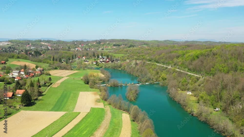 Panoramic view of countryside landscape, Mreznica river and Donji Zvecaj village from air, Croatia
