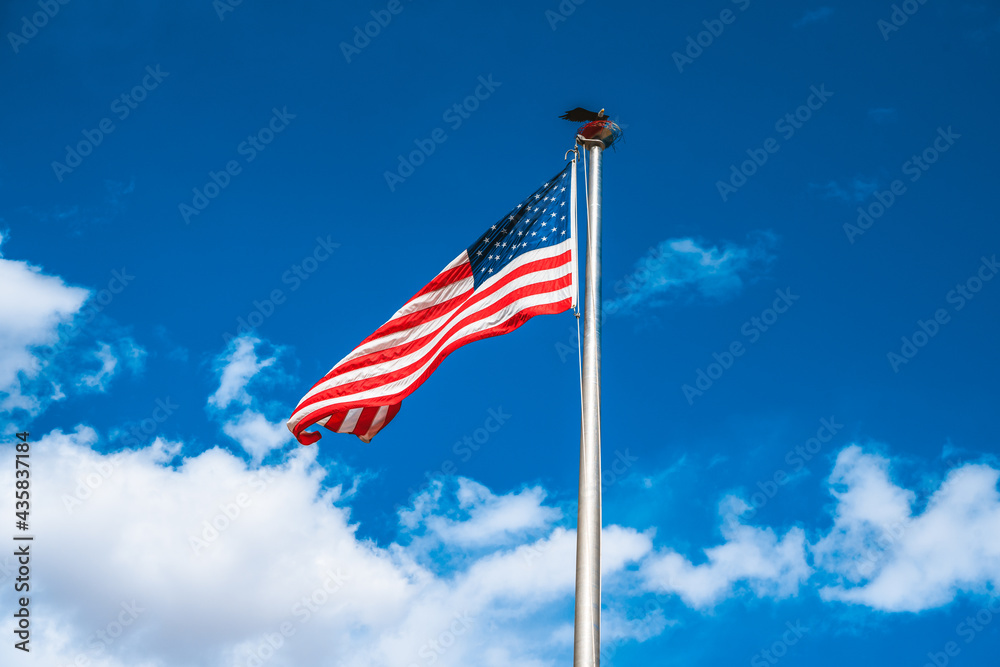 American flag on a blue sky background