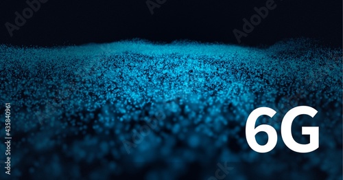 Composition of 6g in white text over glowing blue granular surface on black background photo