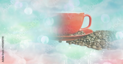 Composition of red cup and saucer with coffee beans with copy space