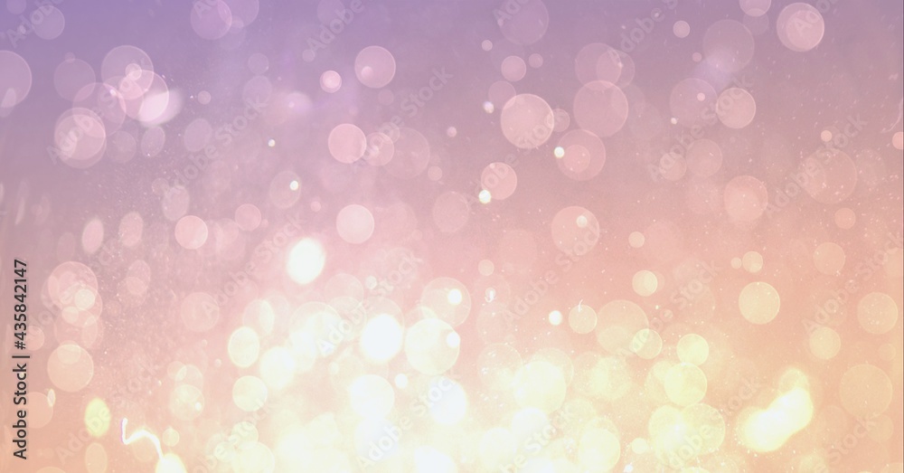 Composition of softly glowing, floating particles with yellow and pink light in bokeh Composition of softly glowing, floating particles with yellow and pink light in bokeh