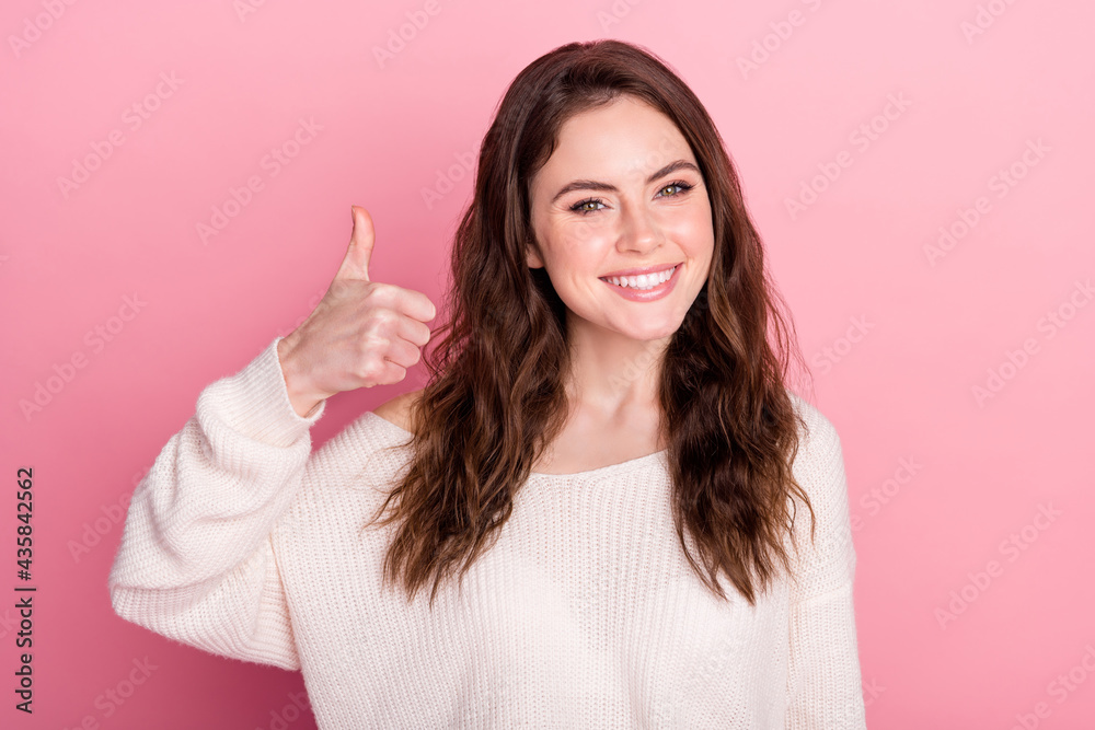 Photo of young attractive girl happy positive smile show thumb-up like cool advert advice isolated over pastel color background Photo of young attractive girl happy positive smile show thumb-up like cool advert advice isolated over pastel color background