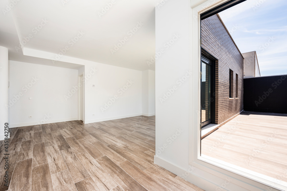 Large living room on the attic floor with ceramic floor and exit to terrace Large living room on the attic floor with ceramic floor and exit to terrace