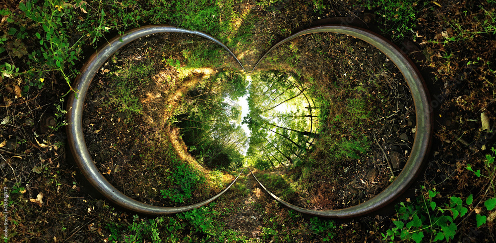 Stereographic projection of a a railroad with trees. 360 degree panorama. Tunnel panorama. Stereographic projection of a a railroad with trees. 360 degree panorama. Tunnel panorama.