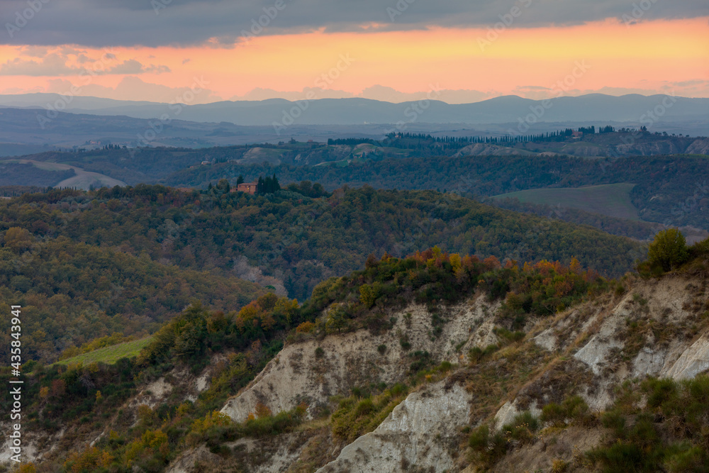 landscape with hills in Tuscany, Italy in autumn at sunset
