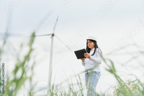 researcher analyzes readouts on wind power station