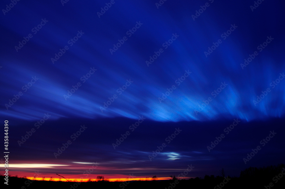 Fototapeta premium Clouds moving in a scenic landscape. Night shot.