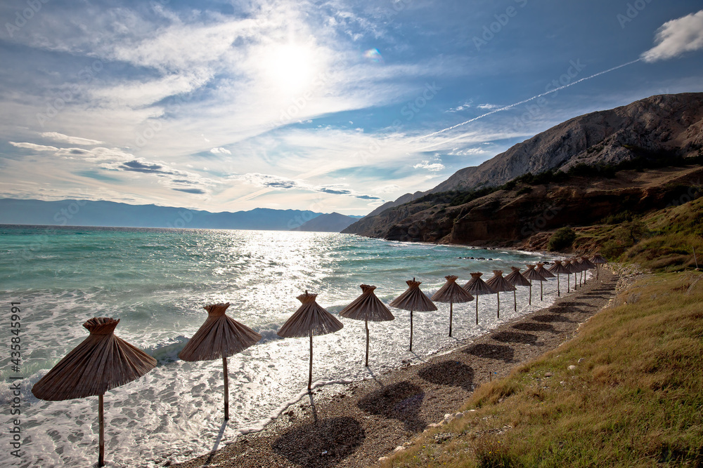Idyllic beach in Baska sun shades view, Island of Krk, Croatia