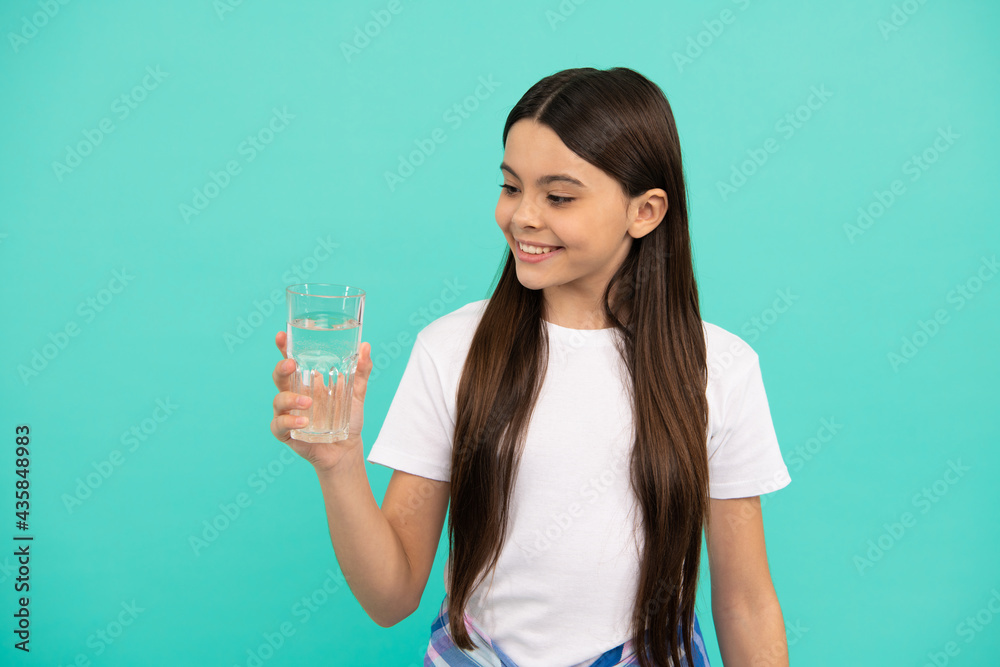 smiling girl going to drink beverage. healthy childhood lifestyle. water balance in body. smiling girl going to drink beverage. healthy childhood lifestyle. water balance in body.
