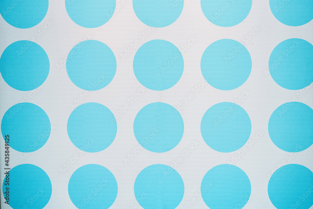 big blue polka dots on white background