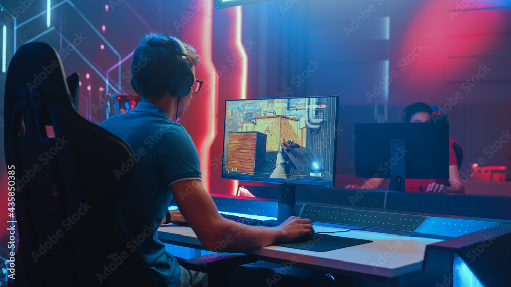 Esport of pro gamer playing video game with new graphics winning  championship, stylish design cyber games room. Virtual shooter game in  cyberspace, esports player performing on pc gaming tournament Stock Photo 