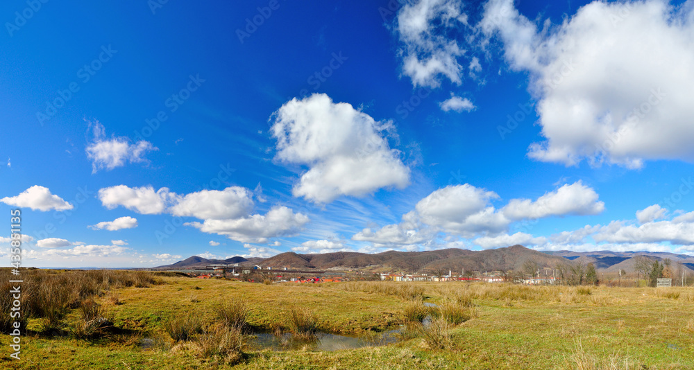 Spring landscape after rain, intense blue sky and clouds Spring landscape after rain, intense blue sky and clouds