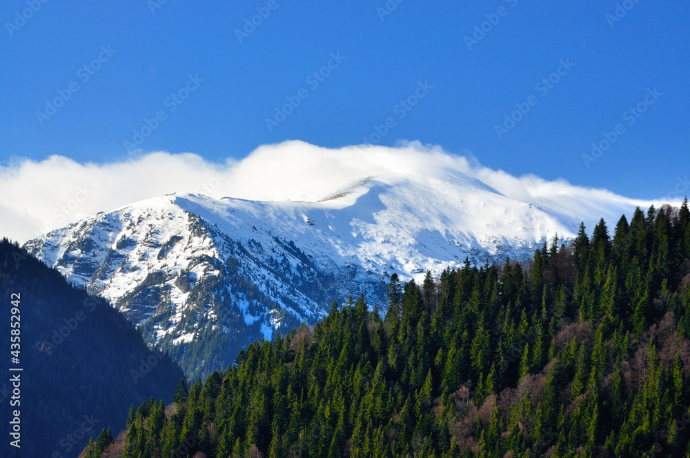 Snow filled mountain peaks in late spring.