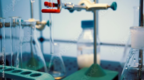 Chemical laboratory with flasks and test tubes. Chemical process with boiling of a chemical solution and synthesis of organic matter photo