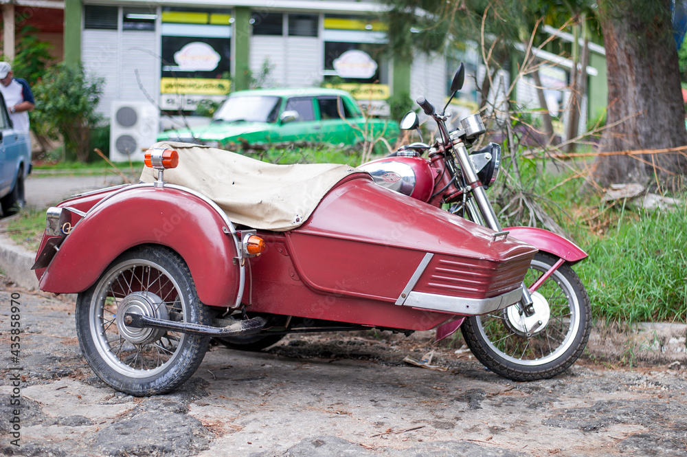 vintage Czech motorcycle with sidecar 50s vehicles frozen in time after the embargo suctions on Cuba