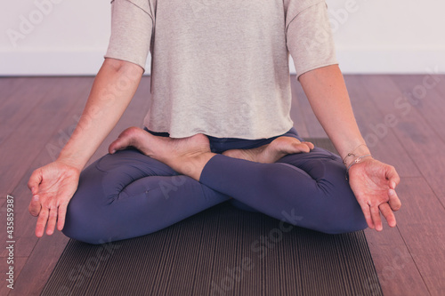 Fototapeta Naklejka Na Ścianę i Meble -  woman meditating in yoga lotus position