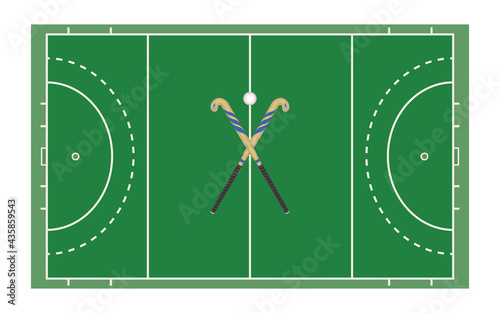 field hockey playing field with crossed sticks and ball photo