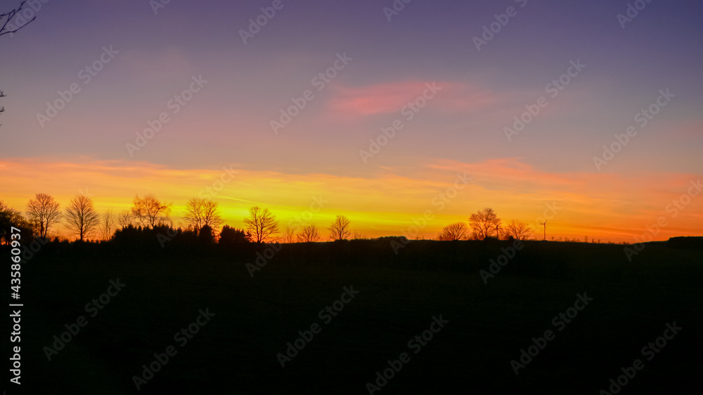 Bright orange-red sky during a sunset