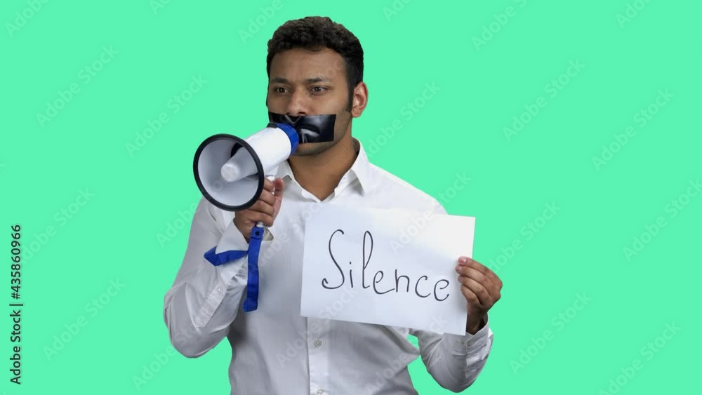 Silenced man with megaphone on color background. Silenced man with megaphone on color background.