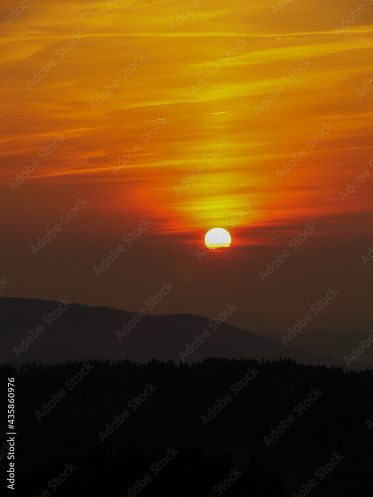 Bright orange-red sky during a sunset Bright orange-red sky during a sunset