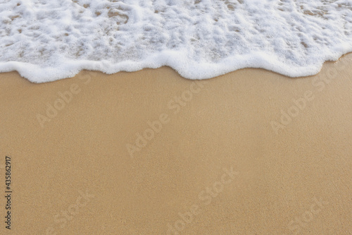 Beautiful ocean waves on the sandy beach Abstract style nature background 
