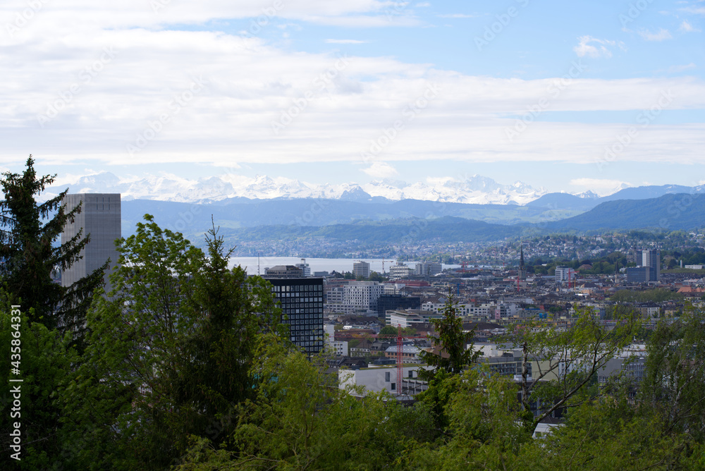Zurich skyline at springtime with Lake Zurich and Swiss alps in the background. Photo taken May 26th, 2021, Zurich, Switzerland.