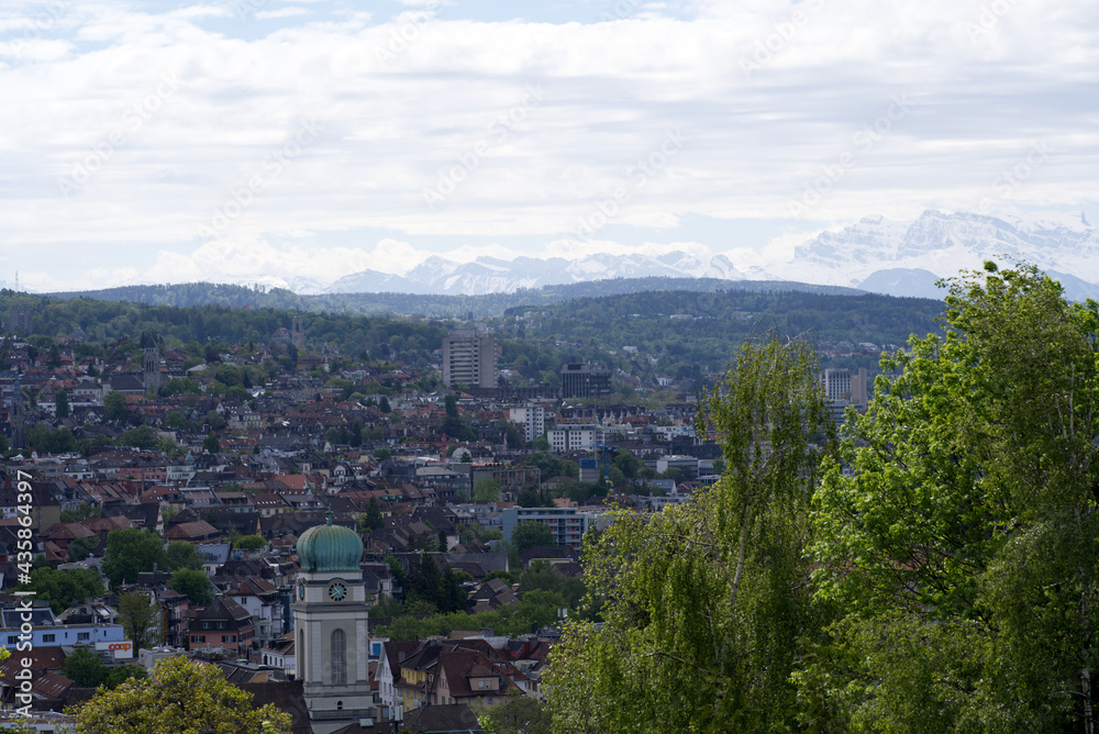 Zurich skyline at springtime with mountains in the background. Photo taken May 26th, 2021, Zurich, Switzerland.