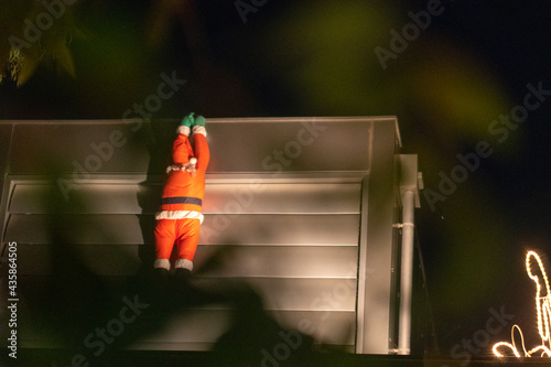 Christmas Santa Claus Secretly Climbing House