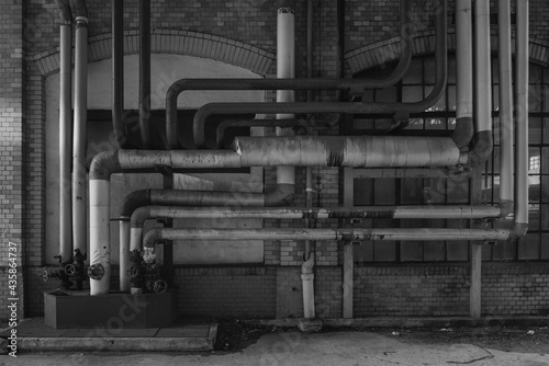 Old pipes on an industrial facade, BLACK AND WHITE PHOTO