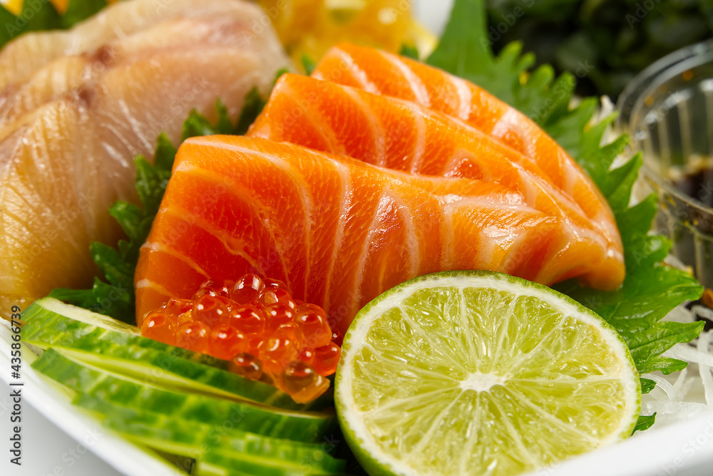 sashimi set, Japanese food. sushi restoran menu. Japanese seafood. sashimi set on plate with cucumber and salad. Takea way sashimi set. sashimi set, Japanese food. sushi restoran menu. Japanese seafood. sashimi set on plate with cucumber and salad. Takea way sashimi set.