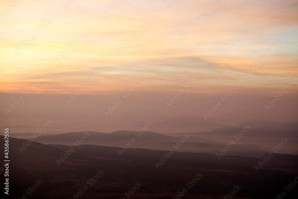 view of foggy mountains at sunrise