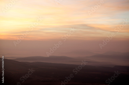 view of foggy mountains at sunrise