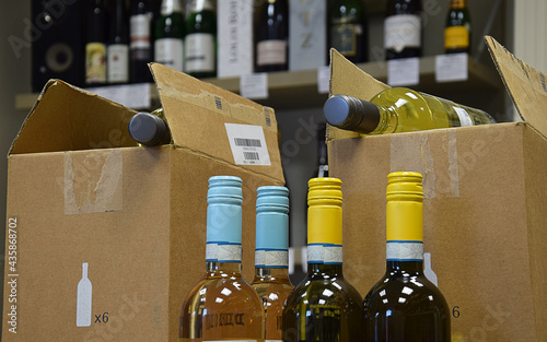 Wine bottles in wine store and ready for home delivery