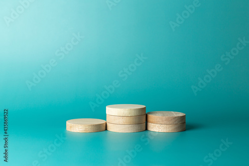Wooden podium standing or podium platform to show producton blue background
