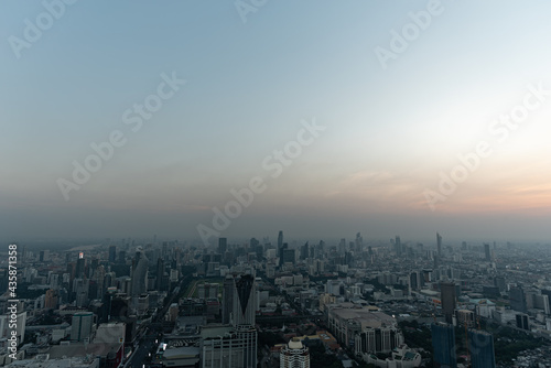 Bangkok city skyline at melacholic lonely misty sunset view from Baiyok ii Tower