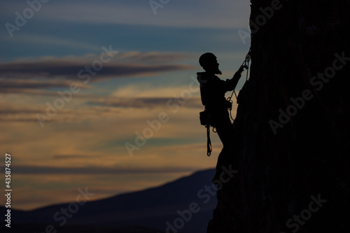 silhouetted climber at dusk