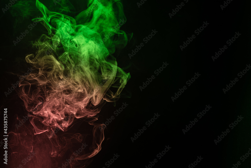 Green and pink steam on a black background. Green and pink steam on a black background.