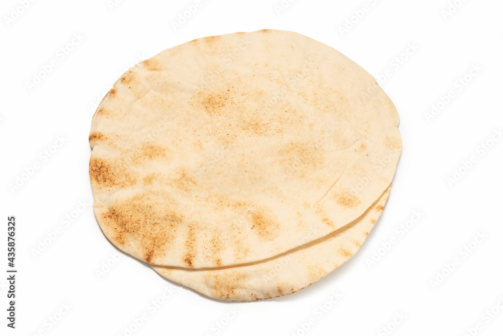 Grilled pitta bread isolated on white background. Grilled pitta bread isolated on white background.