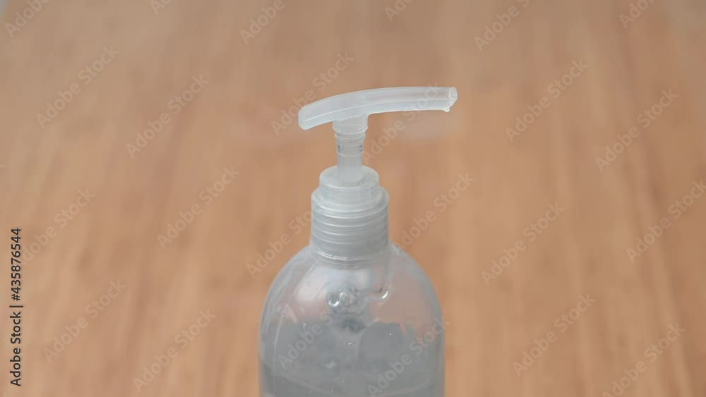 Close-up of man using hand sanitizer dispenser disinfecting with gel to prevent spreading virus (such as corona virus covid-19 sars-cov-2) or bacteria virus infection disease. 4k camera footage. Close-up of man using hand sanitizer dispenser disinfecting with gel to prevent spreading virus (such as corona virus covid-19 sars-cov-2) or bacteria virus infection disease. 4k camera footage.