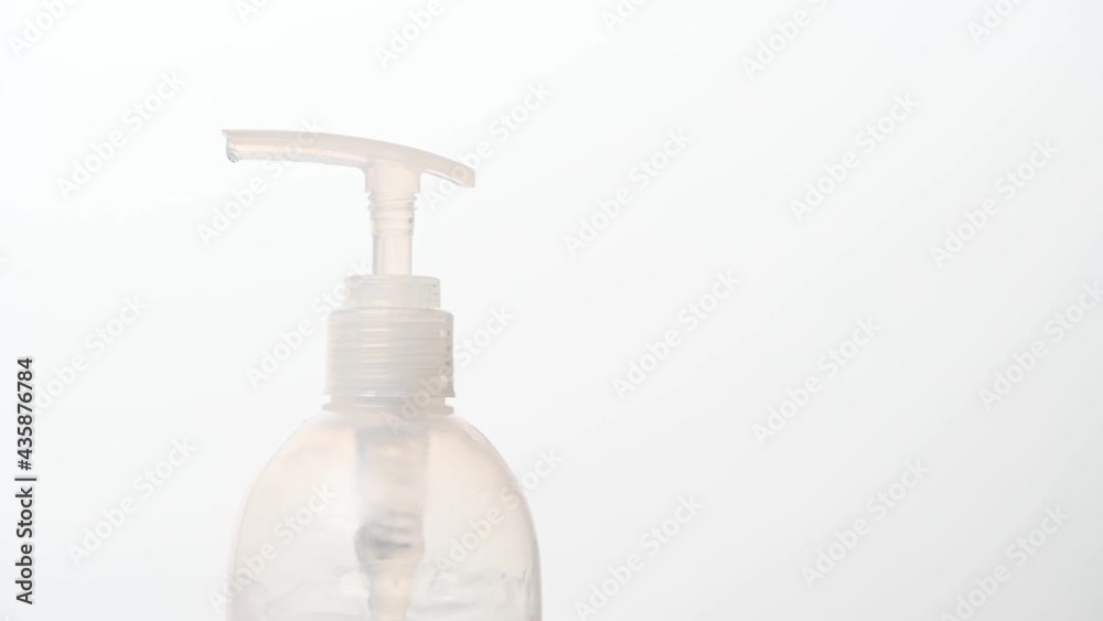 Close-up of man using hand sanitizer dispenser disinfecting with gel to prevent spreading virus (such as corona virus covid-19 sars-cov-2) or bacteria virus infection disease. 4k camera footage. Close-up of man using hand sanitizer dispenser disinfecting with gel to prevent spreading virus (such as corona virus covid-19 sars-cov-2) or bacteria virus infection disease. 4k camera footage.