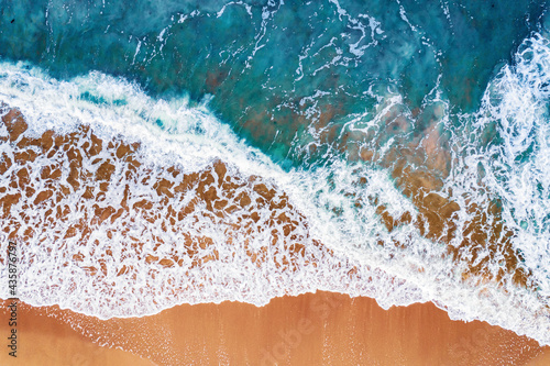 Turquoise water with wave with sand beach background from aerial top view. Concept summer sunny travel image © Parilov