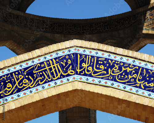Fototapeta Calligraphy of a Quran verse on mosaics of a martyr tomb in Tehran, Iran