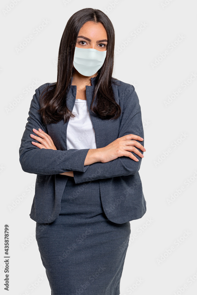 Studio photograph of a Brazilian woman wearing a face mask against COVID 19, isolated on white background Studio photograph of a Brazilian woman wearing a face mask against COVID 19, isolated on white background